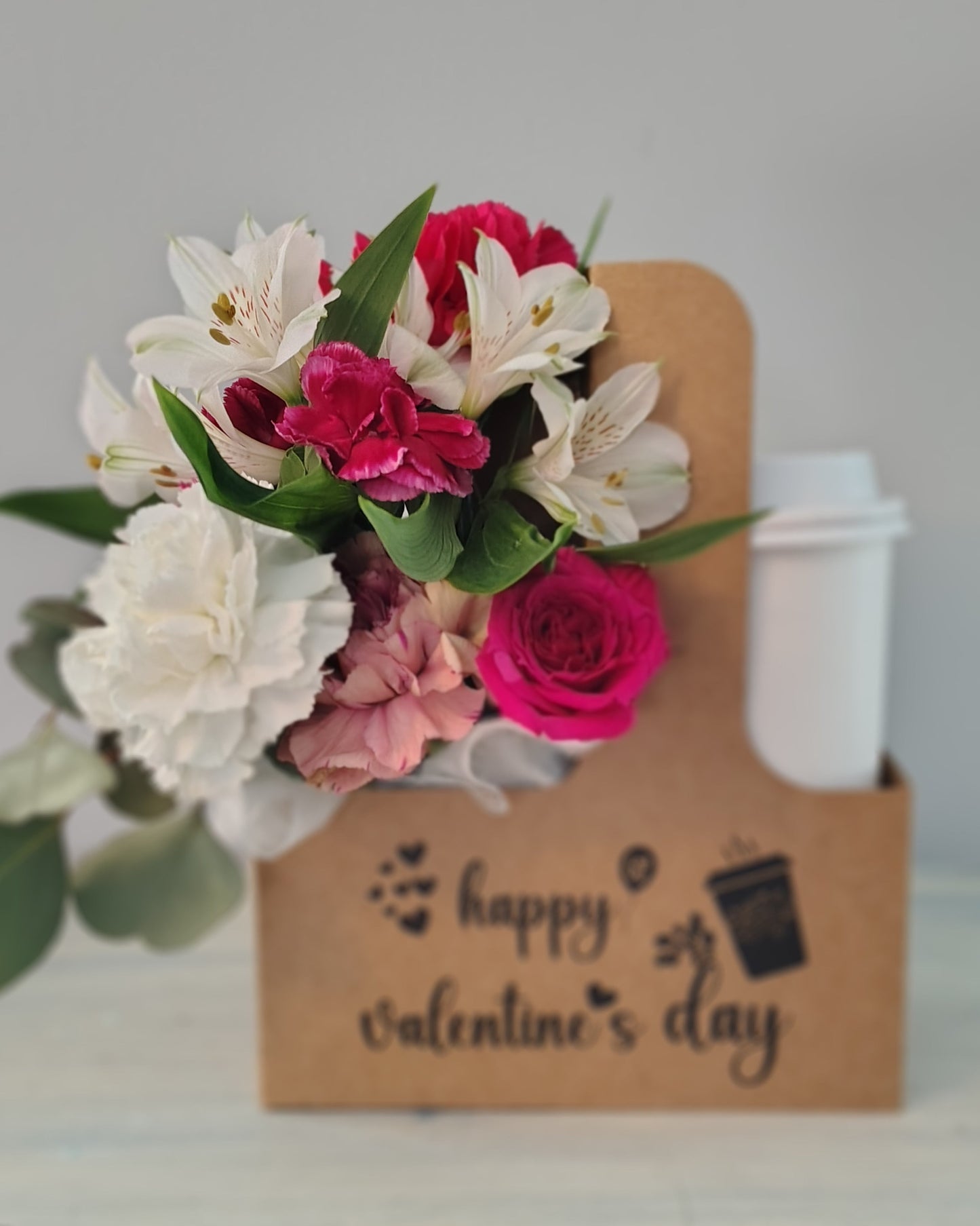 Flowers in coffee carrier