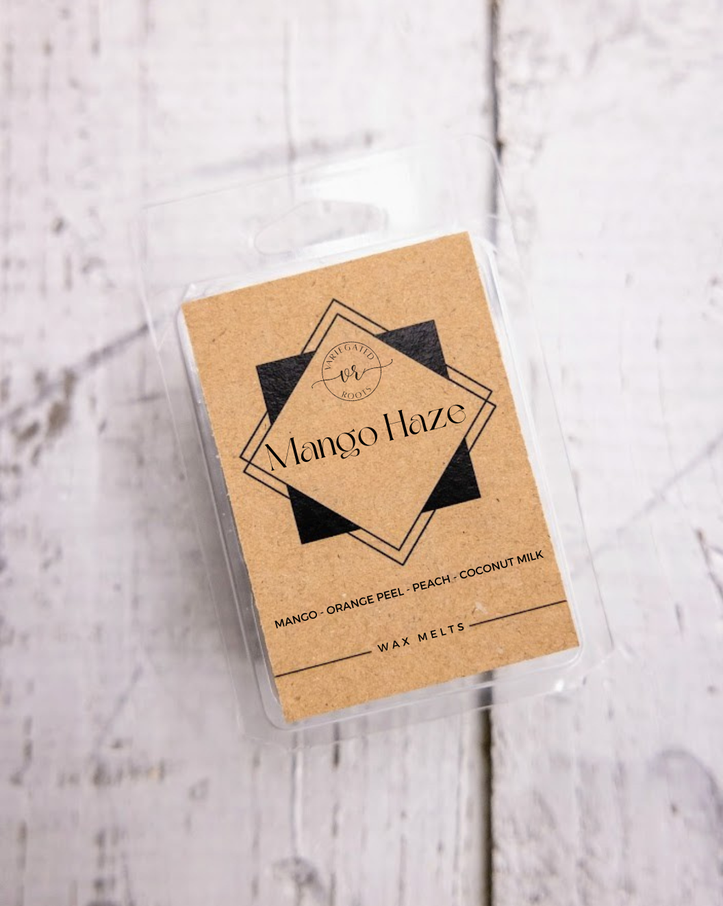 Pack of wax melts labeled 'Mango Haze' on a light wooden surface