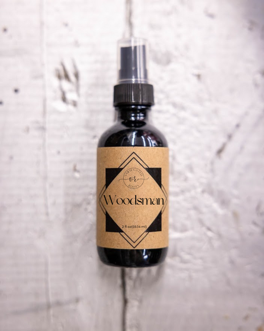 Bottle labeled 'Woodsman' on a textured white background
